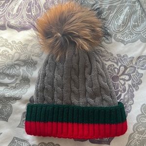 Striped winter hat with faux fur Pom Pom